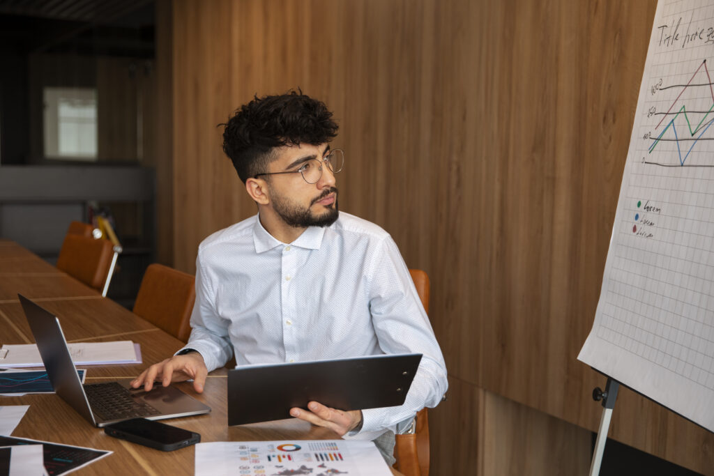 office worker using finance graphs
